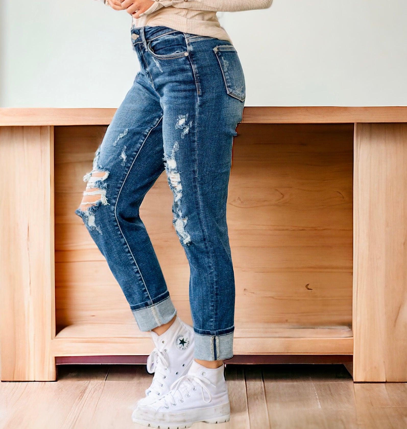 Model wearing JUDY BLUE ZOE Boyfriend Jeans, dark wash with distressed details and cuffed hem.