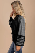 Finding Time (soft black) long sleeve top featuring a stylish striped and graphic print design.