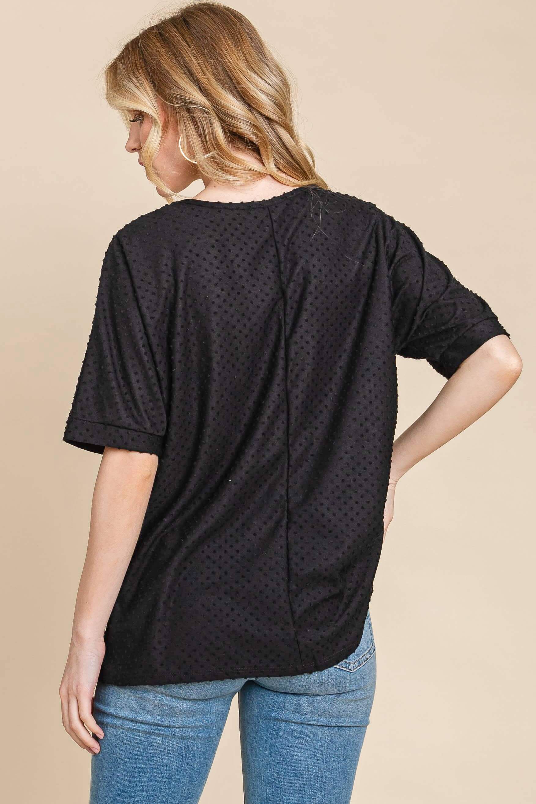 Back view of the Midnight Moments Top in black with Swiss dot texture, perfect for work or casual outings.