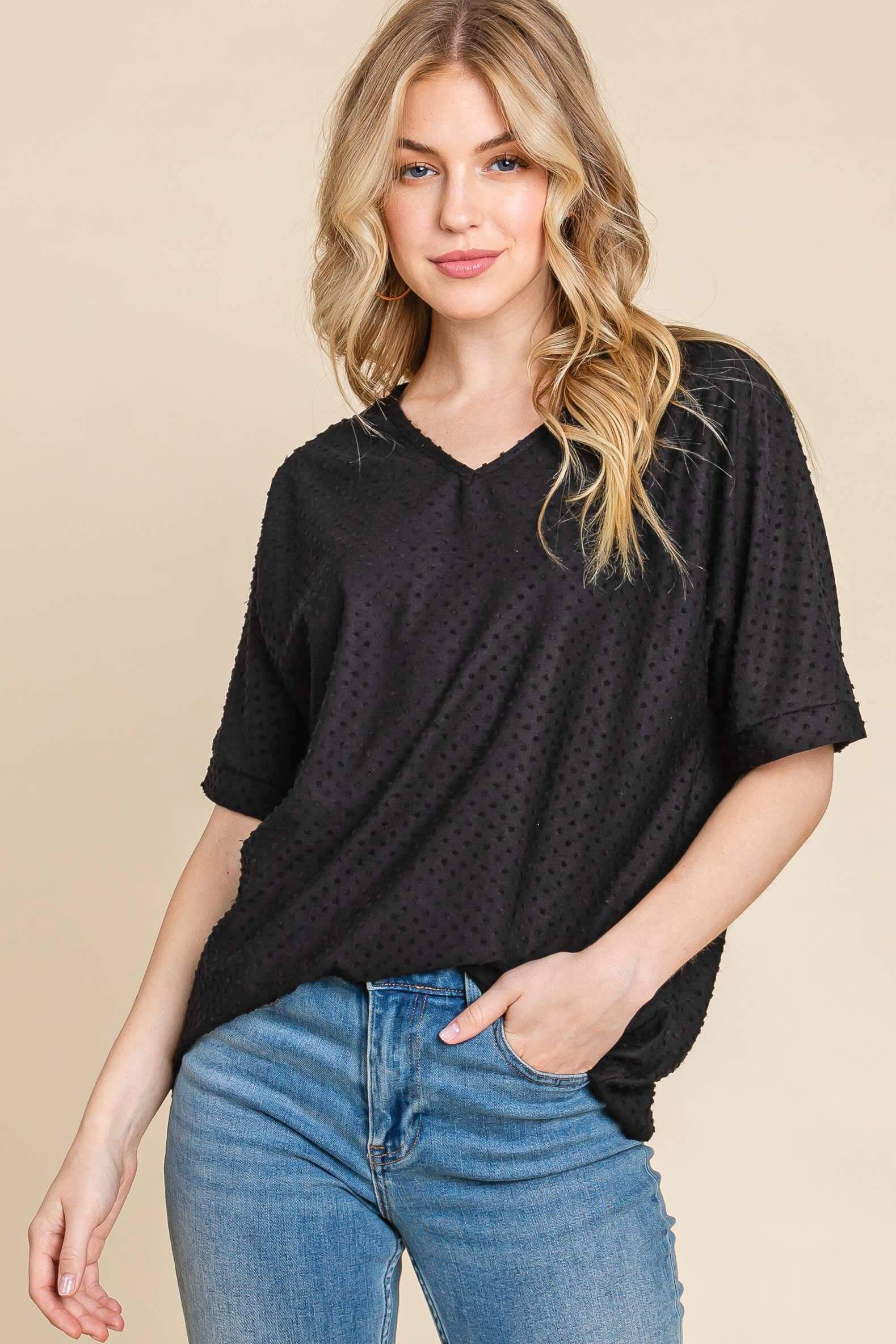Relaxed fit black Midnight Moments Top with tufted Swiss dot texture, perfect for work or casual weekends.