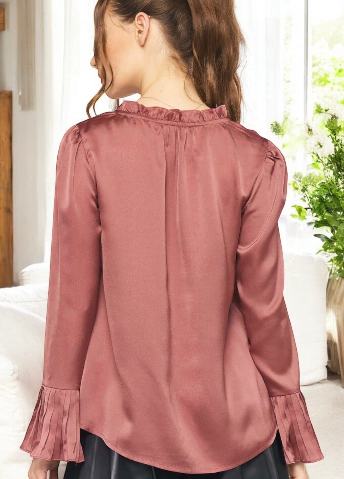 Back view of the Graceful Elegance Blouse by Entro in mulberry, showcasing pleated bell cuffs and ruffle detailing.