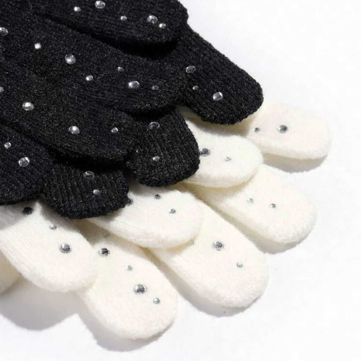 STILL BEJEWELED gloves in winter white and jet black with sparkly rhinestones for stylish warmth.