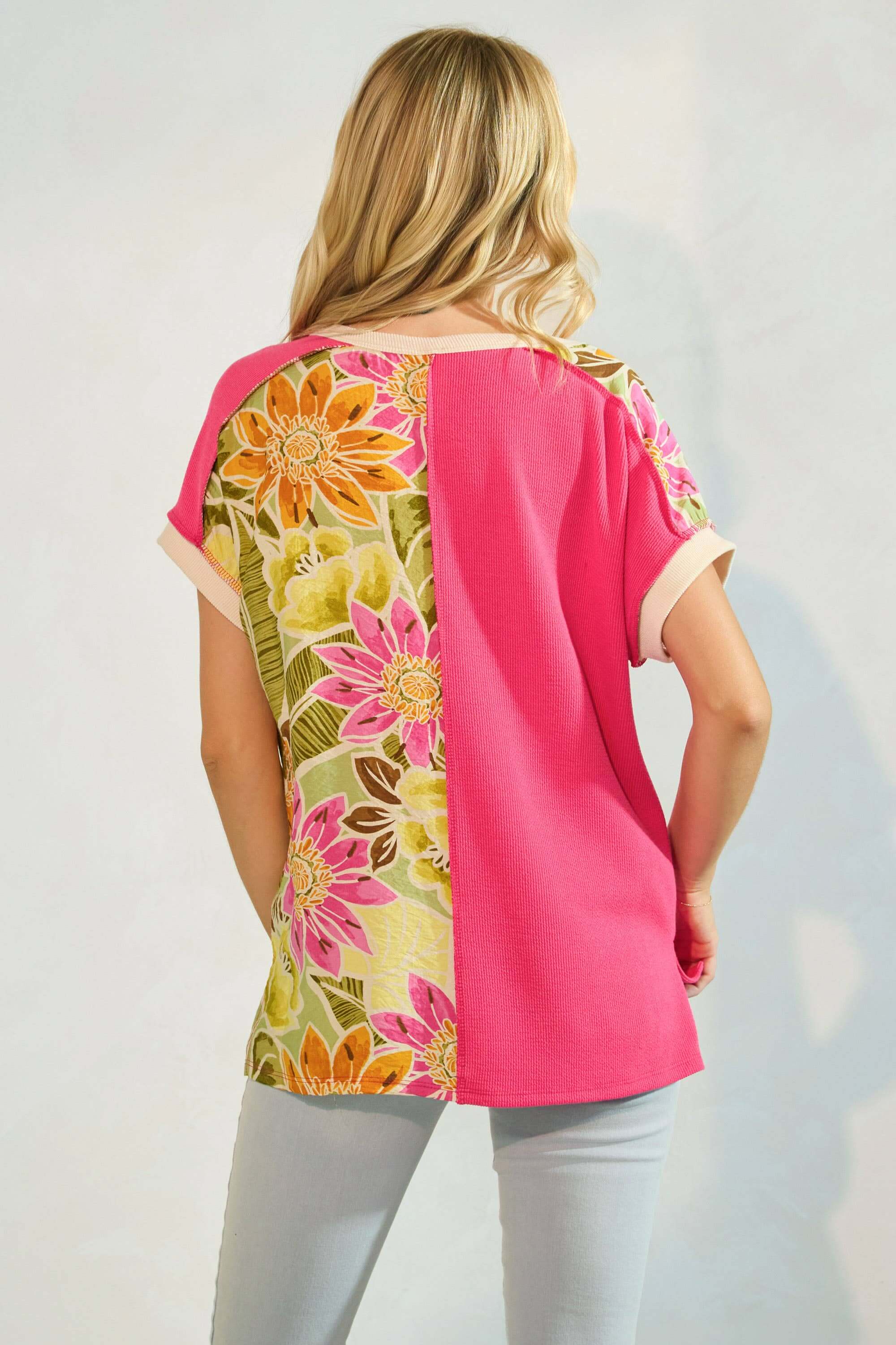 Colorblock floral tee in fuschia and vibrant colors, perfect for casual weekend outings. Back view of relaxed fit style.