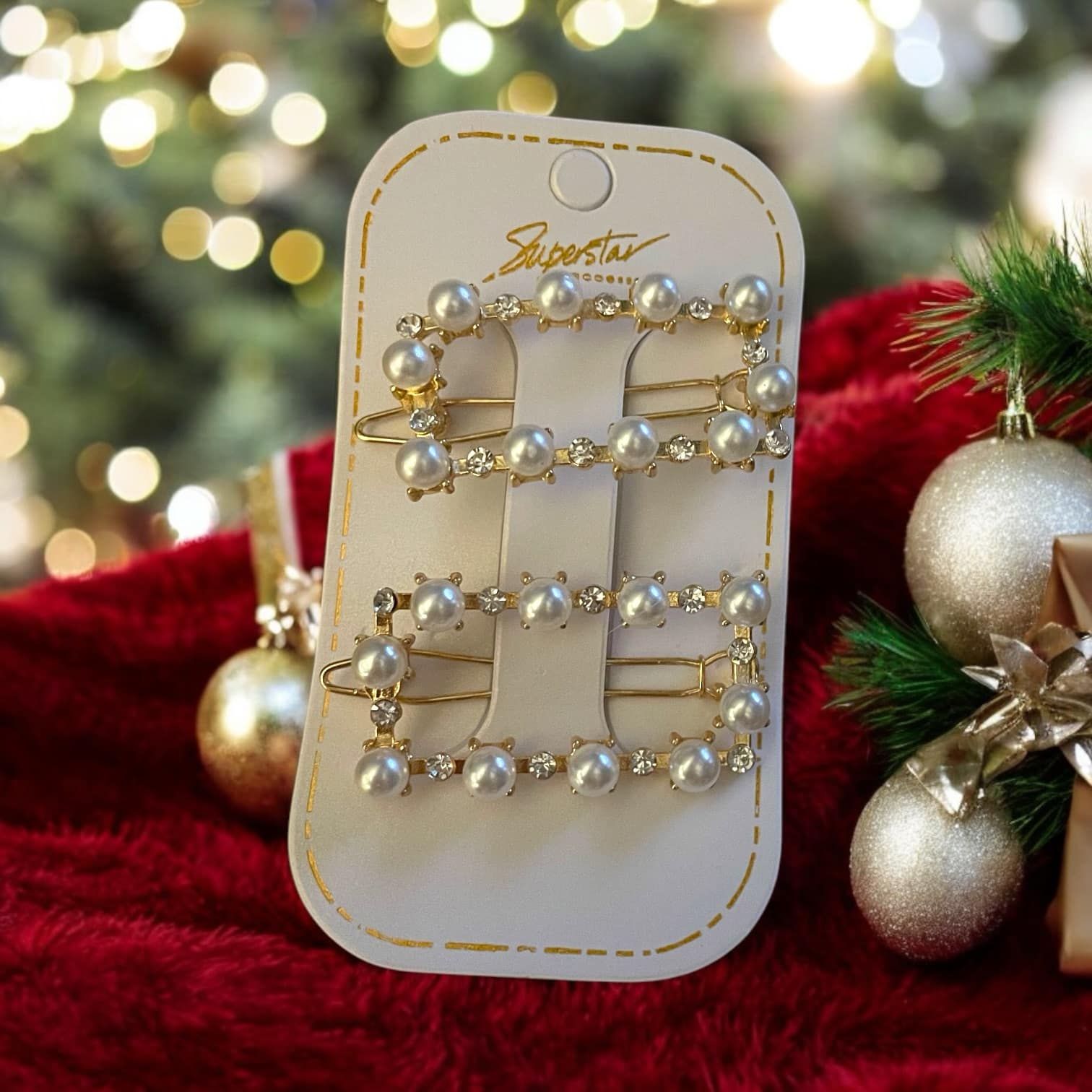 Set of two gold tone barrettes with faux pearls and rhinestones, featuring assorted shapes for holiday styling.
