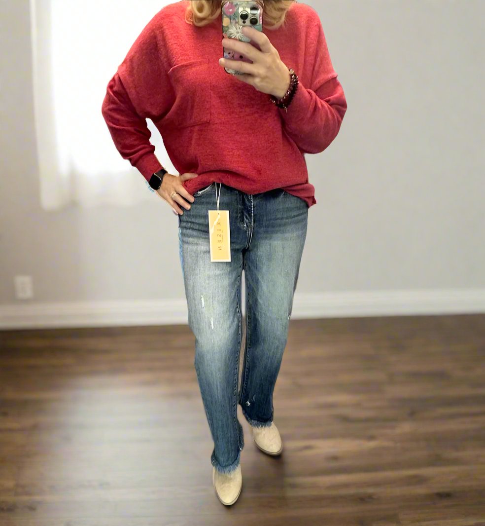 Model wearing RISEN Bianca Jeans with a red sweater, showcasing a casual and stylish outfit.