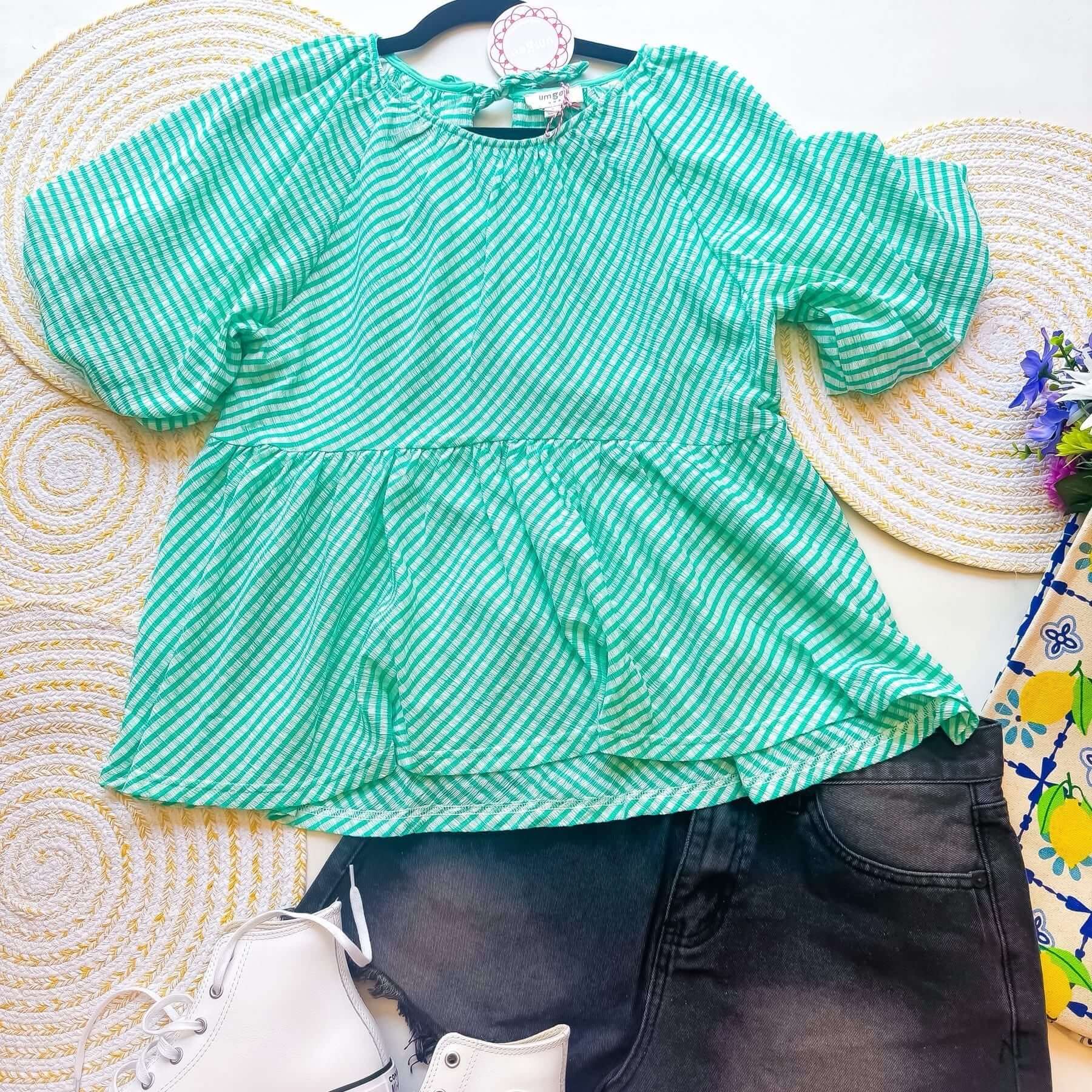 Turquoise checkered top by Umgee with puff sleeves and relaxed fit, perfect for a stylish summer look.