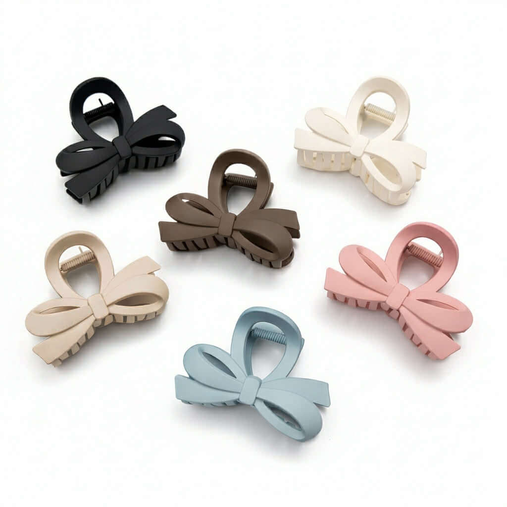 DAILY DARLING BOW HAIR CLIP (6 colors) displayed in black, brown, cream, pink, blue, and white.