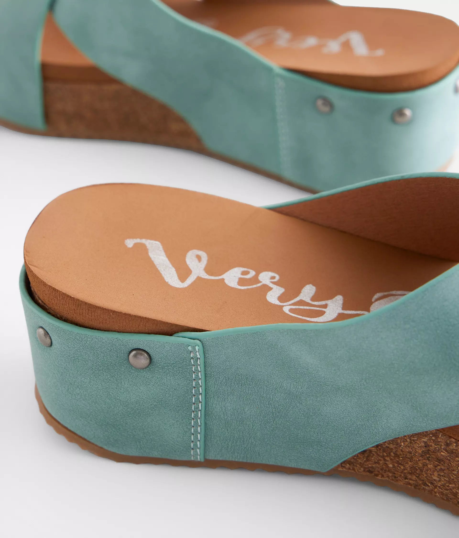 Teal cork wedge sandals by Very G with distressed faux leather straps and studded details.