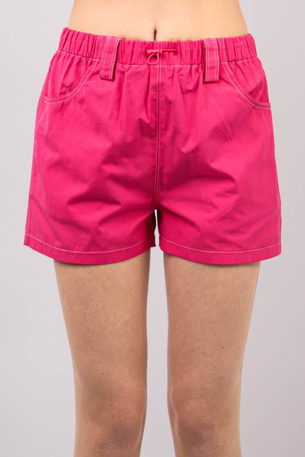 Bright hot pink Play It Cool Shorts with elastic waistband, perfect for casual outings and sporty looks.
