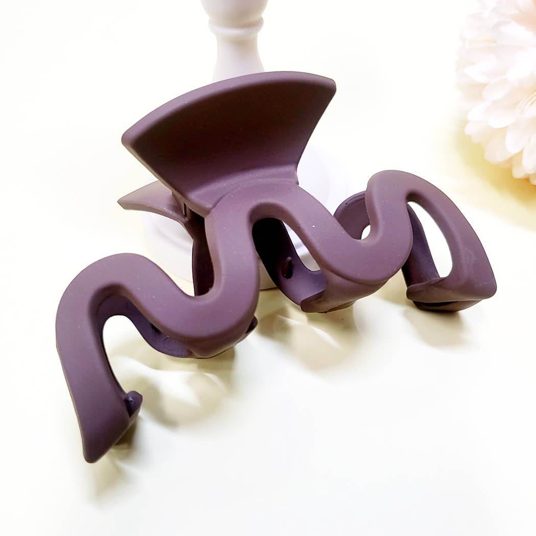 Matte wavy Curve Appeal hair claw clip in deep purple, perfect for trendy and secure hairstyles.