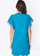 Back view of the Camilia Crochet Trim Dress in teal, featuring short lace sleeves and a sleek silhouette.