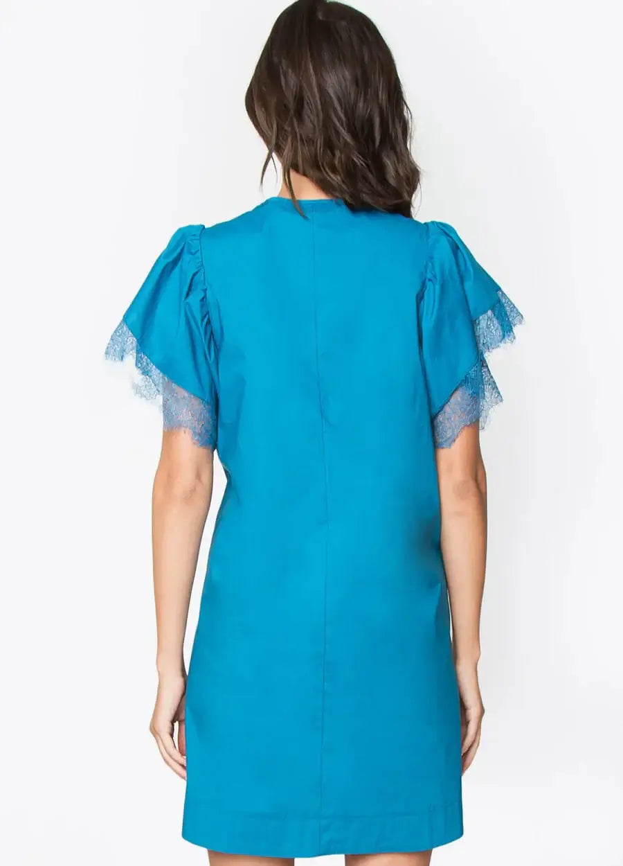 Back view of the Camilia Crochet Trim Dress in teal, featuring short lace sleeves and a sleek silhouette.