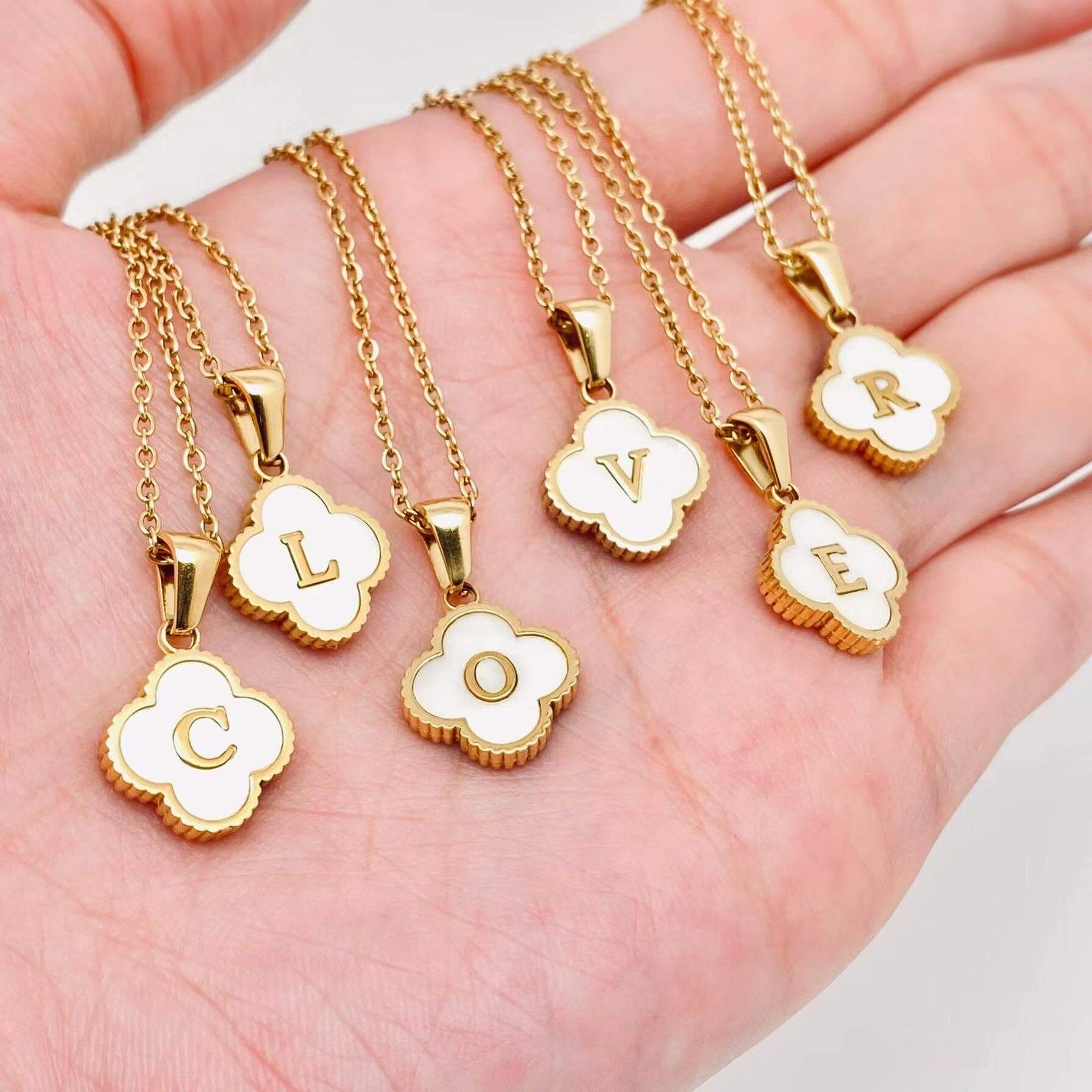 MONOGRAM MOMENTS NECKLACE showcasing elegant gold pendants with white initials CLOVER.