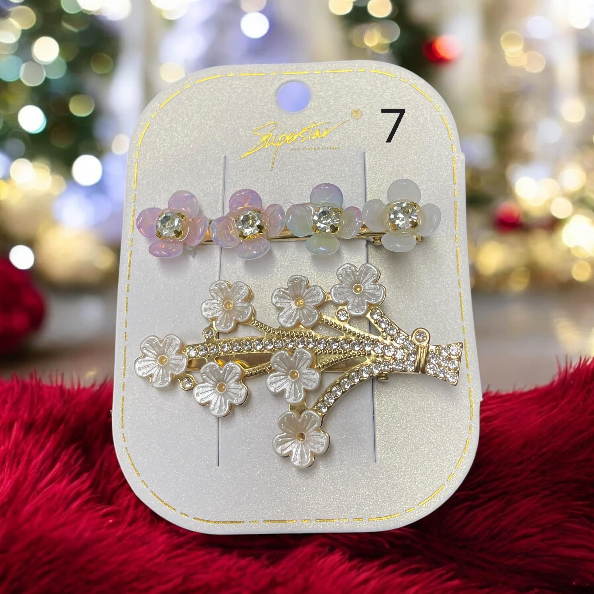 Set of two rhinestone and flower hair clips in pastel colors with intricate designs for elegant hairstyles.