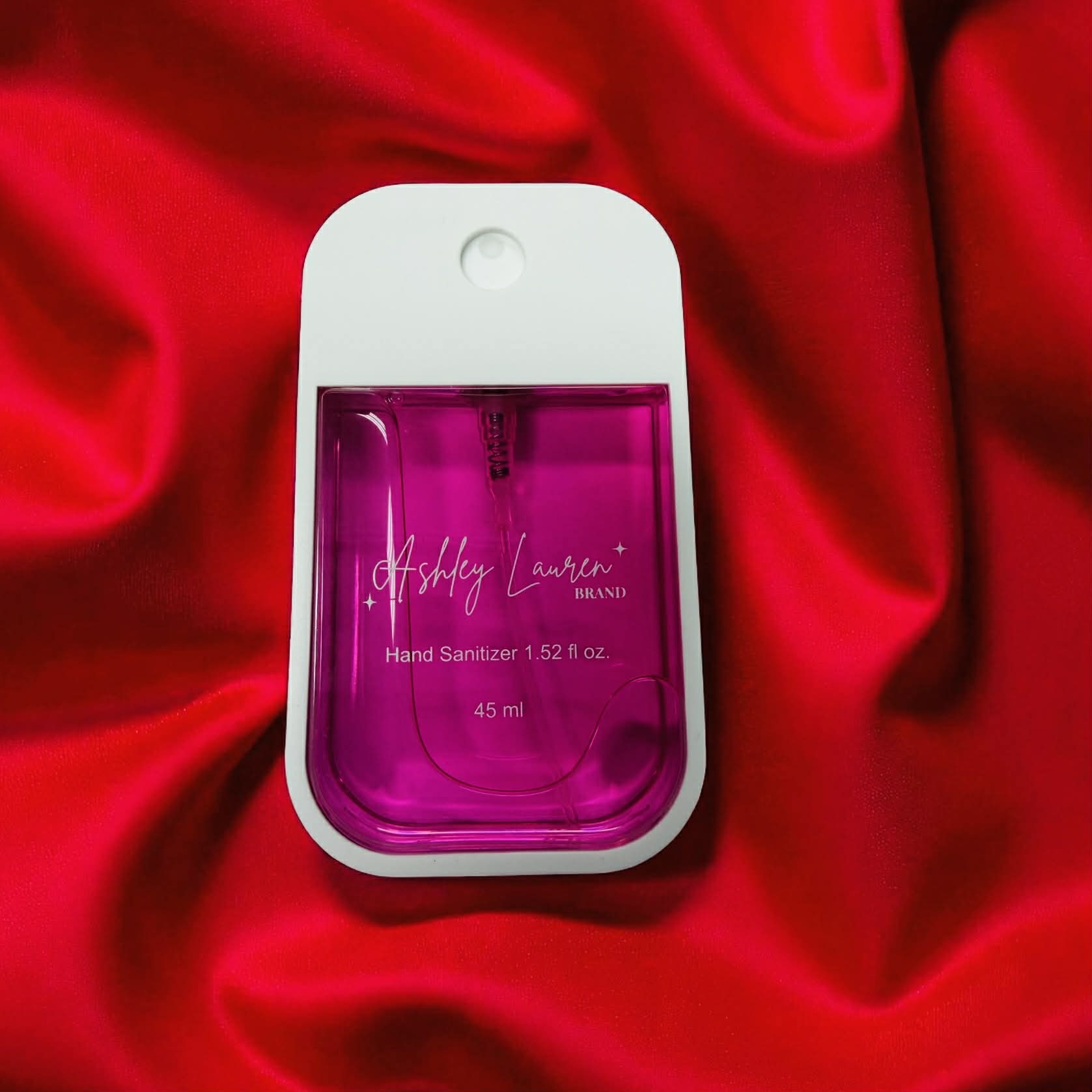 ASHLEY LAURA XL Cinnamon Vanilla HAND SANITIZER in a pink bottle on a red background