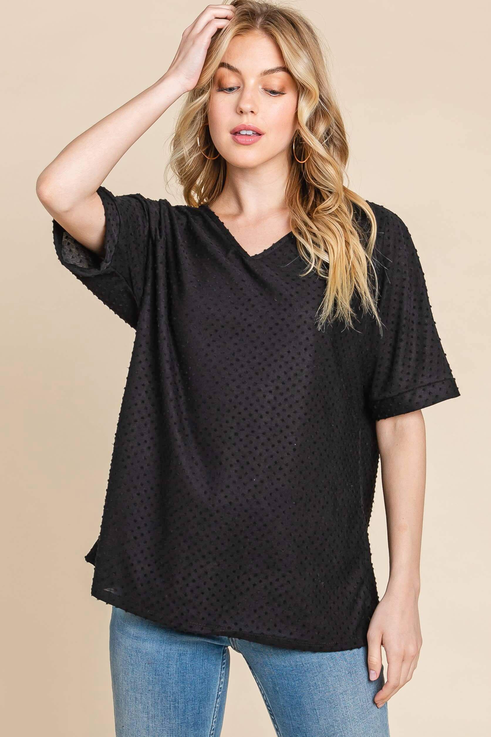Model wearing Midnight Moments Top with Swiss dot texture, perfect for casual or work settings.