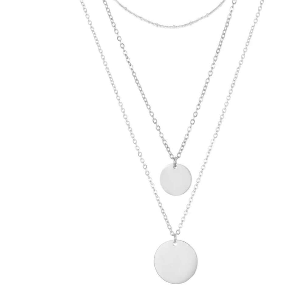 Infinitely Faithful Necklace Set featuring three minimalist layered chains with polished disc pendants in stainless steel.