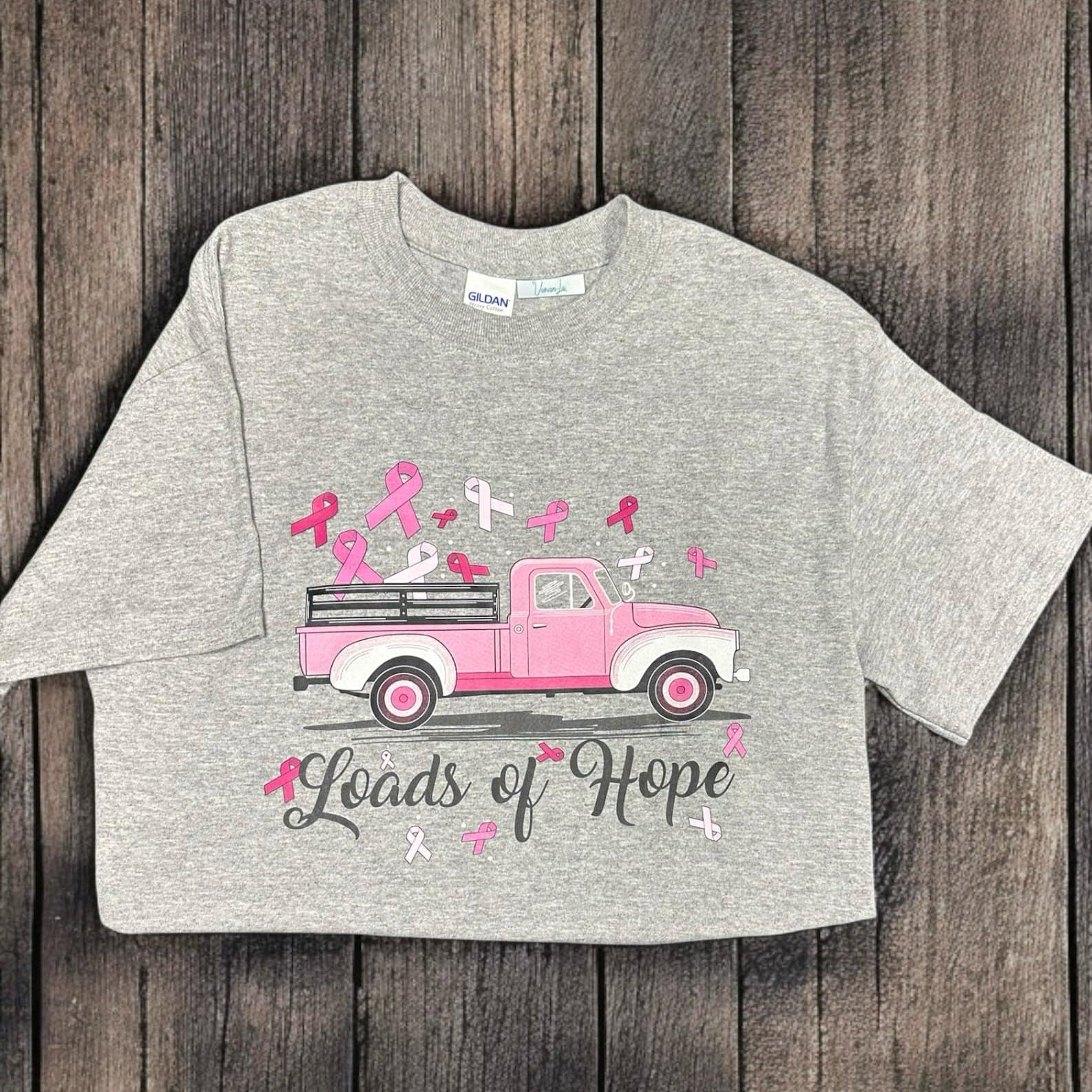 Loads of Hope T-Shirt featuring a pink truck and pink ribbons for breast cancer awareness.