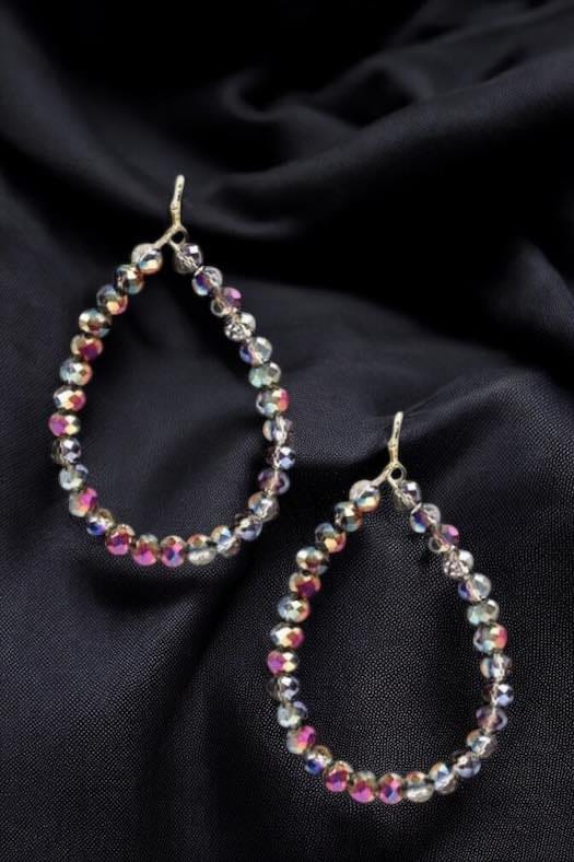 Faith beaded teardrop hoop earrings featuring colorful beads on a black fabric backdrop.