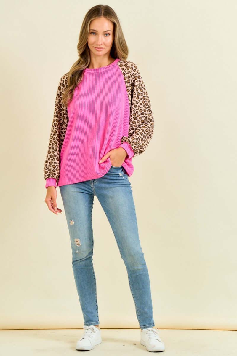WILD CRUSH TOP - Lovely Melody featuring hot pink body and leopard print balloon sleeves against a light background.