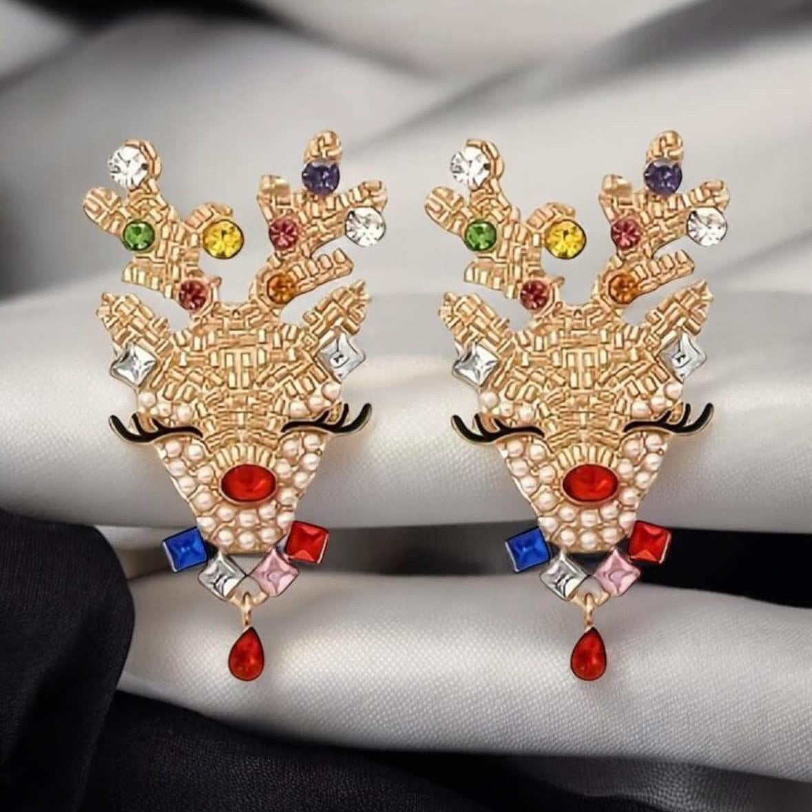 Gold tone rhinestone reindeer stud Christmas earrings with colorful stones, measuring 2" x 1.25".