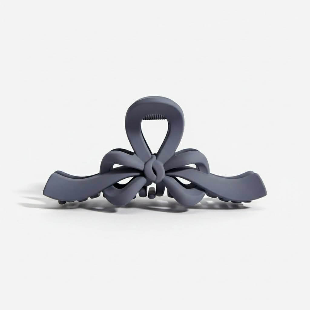 RIBBON REVIVAL HAIR CLIP (7 colors) in matte gray, featuring a bow design that combines style and function.