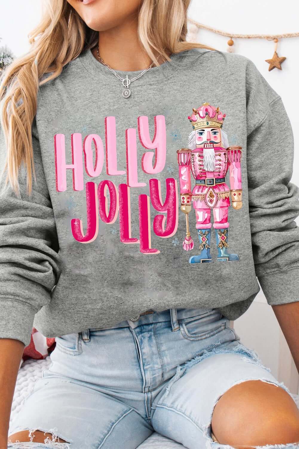 Holly Jolly Nutcracker sweatshirt featuring festive prints, perfect for holiday casual wear.