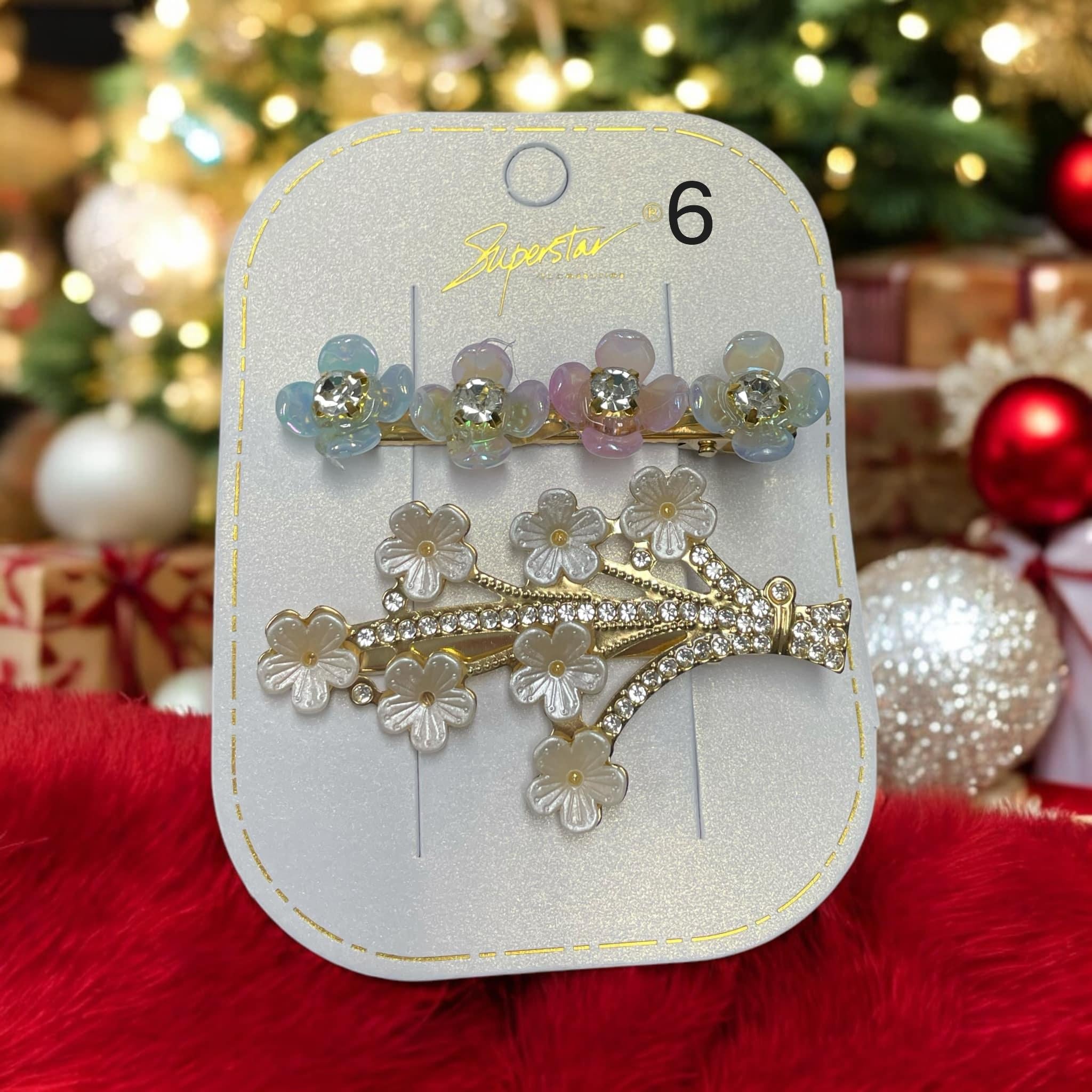 Set of two colorful rhinestone and flower hair clips, perfect for holiday styling and enhancing any hairstyle.