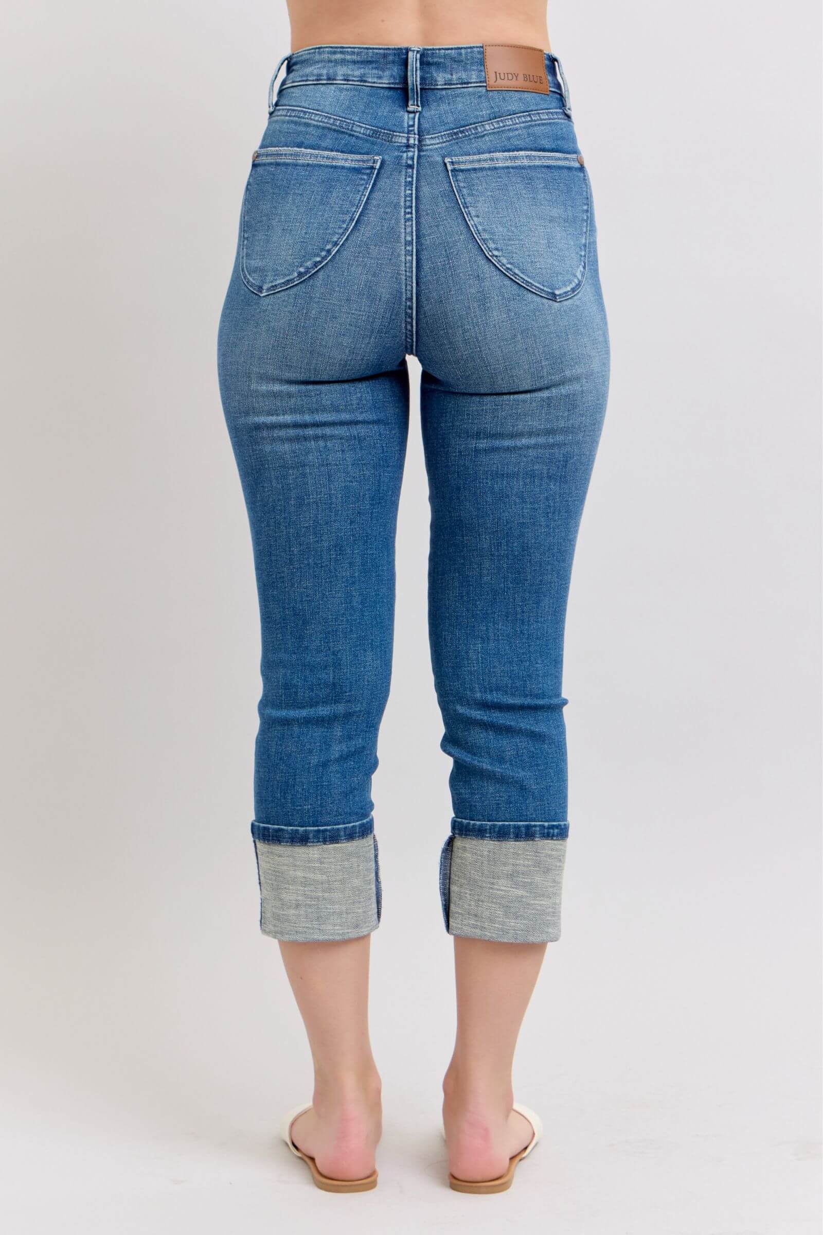 High waist Judy Blue Charli capris in medium wash, showing back view with cuffed hem and no distressing.