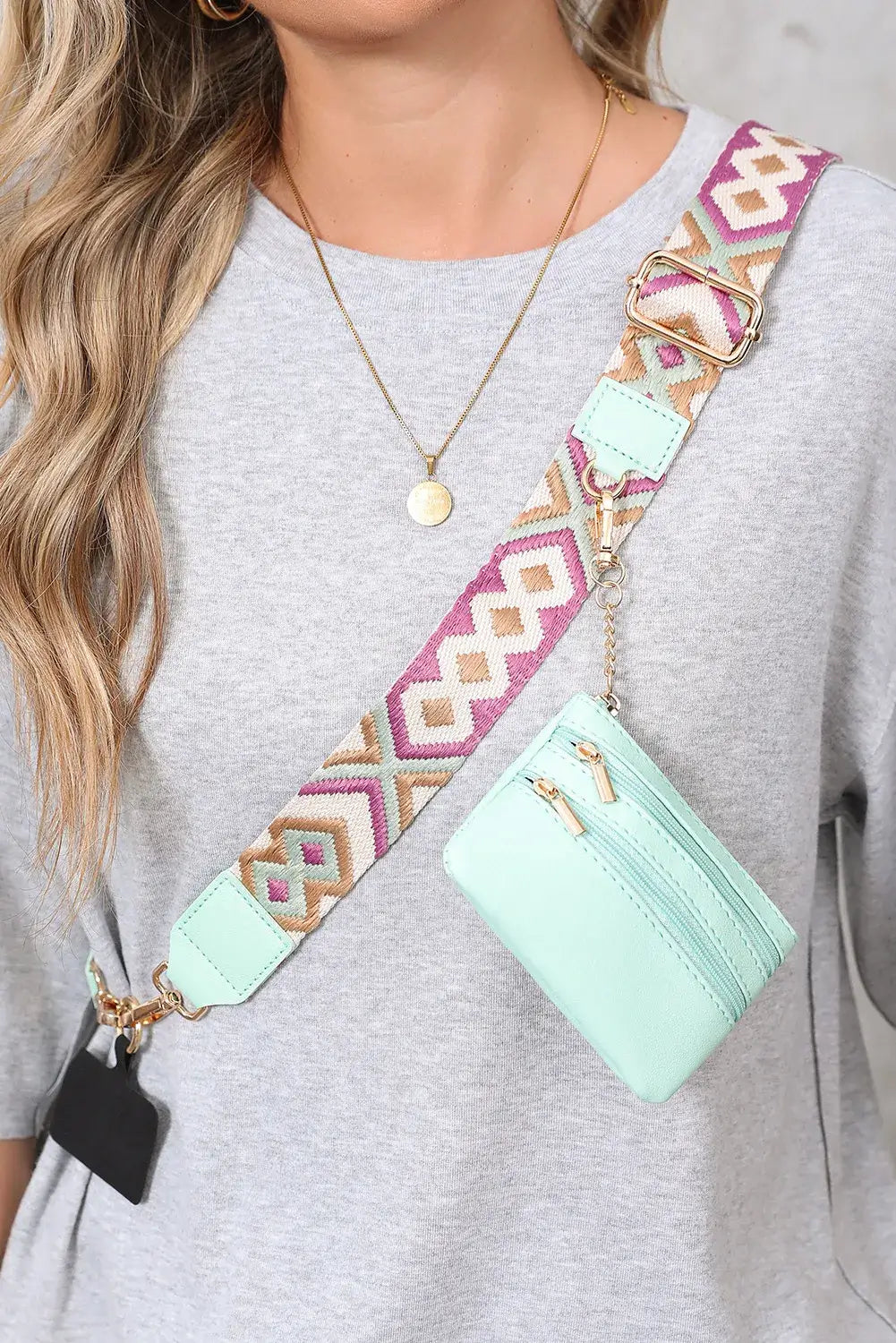 Hands-Free Harmony Crossbody in mint green, featuring a geometric strap and detachable pouch, worn stylishly.