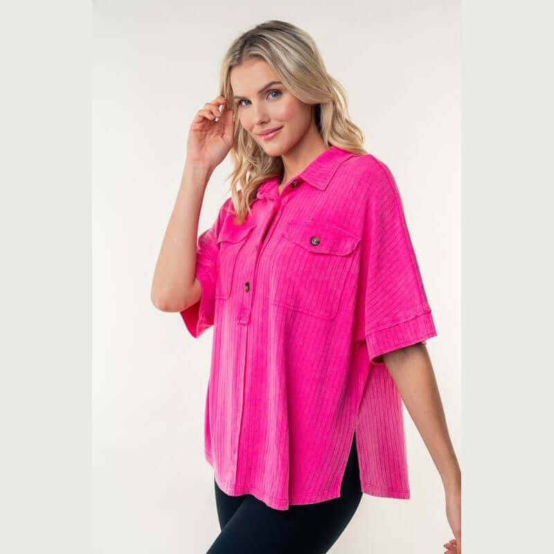 Downtown Breeze Top in pink, featuring a collared design, half-button placket, and flap pockets, perfect for casual styling.