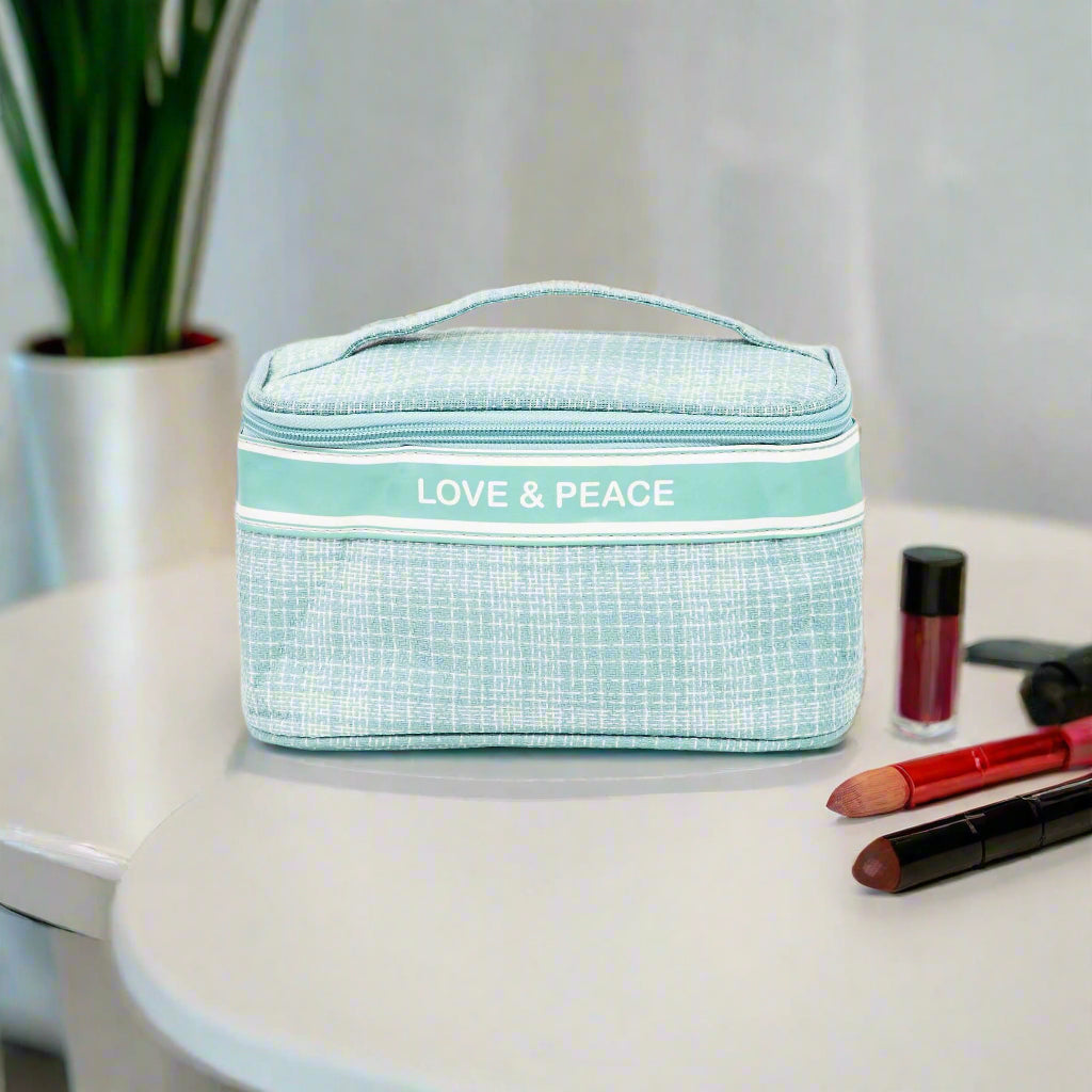 LOVE & PEACE cosmetic bag with striped handle, stylish accessory for makeup and toiletries.