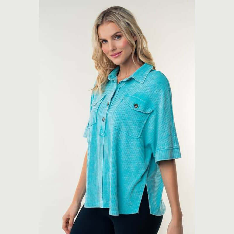 Aqua Downtown Breeze Top featuring half-button placket and flap pockets, perfect for casual wear.