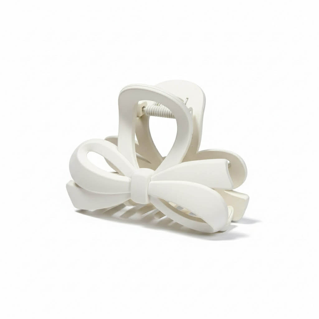 DAILY DARLING BOW HAIR CLIP (6 colors) in white with a smooth matte finish and bow design.