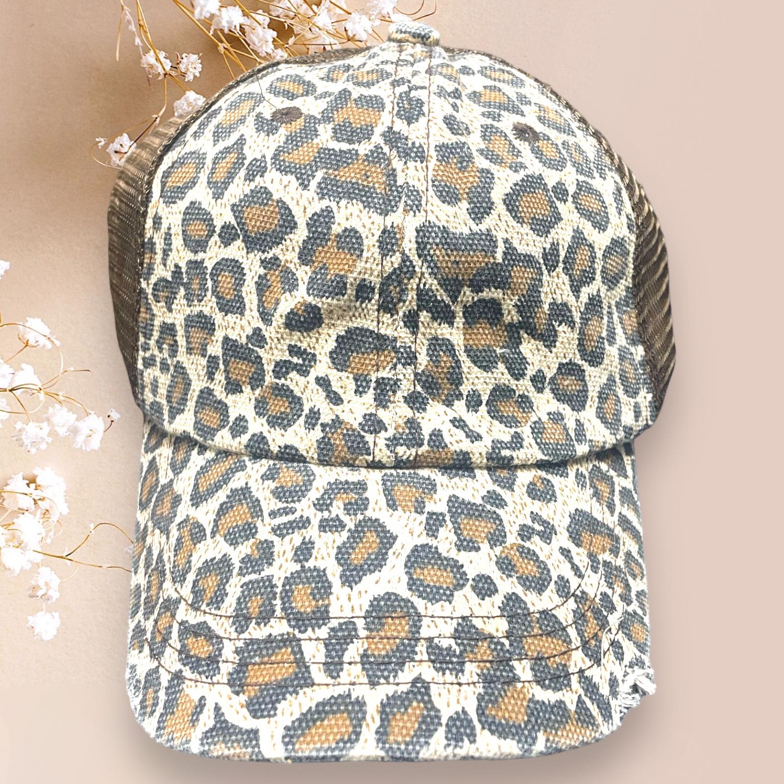 Distressed leopard print Katydid baseball cap with adjustable mesh back for trendy retro style.