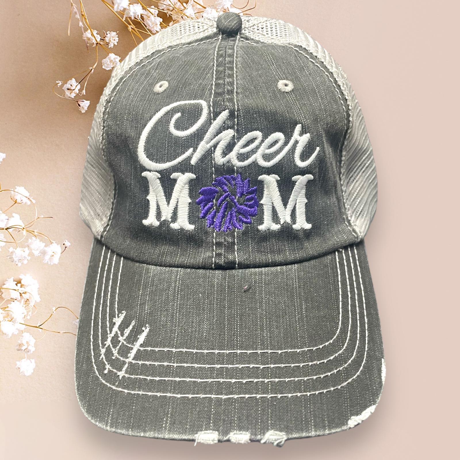 Distressed grey baseball cap featuring 'Cheer MOM' embroidery and adjustable mesh back, perfect for retro style.