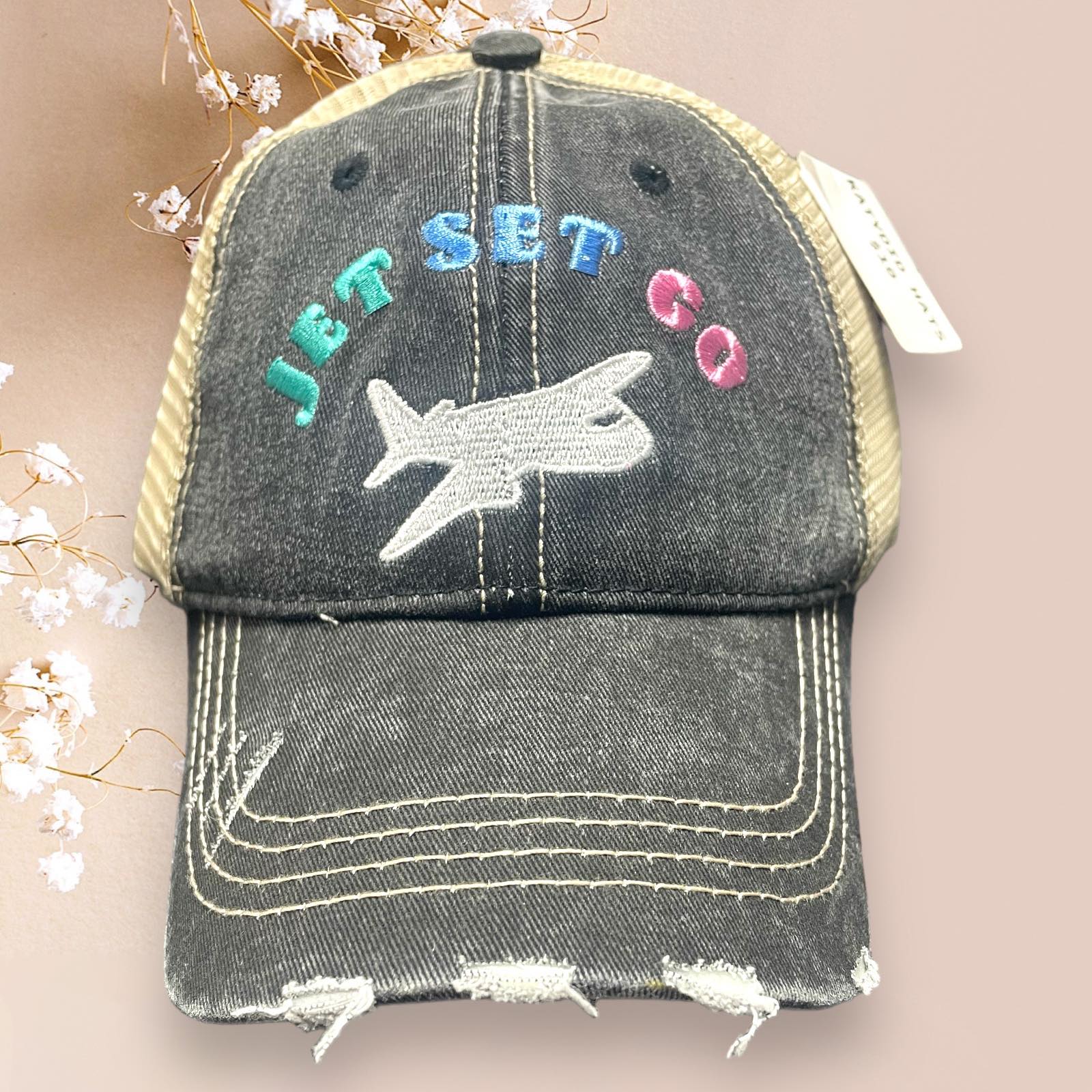 Distressed Katydid baseball cap with 'Jet Set Go' embroidered design and adjustable mesh back.