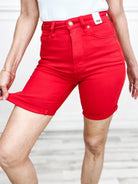 JUDY BLUE tummy control shorts in vibrant love red, showcasing a flattering fit and stylish rolled hem.