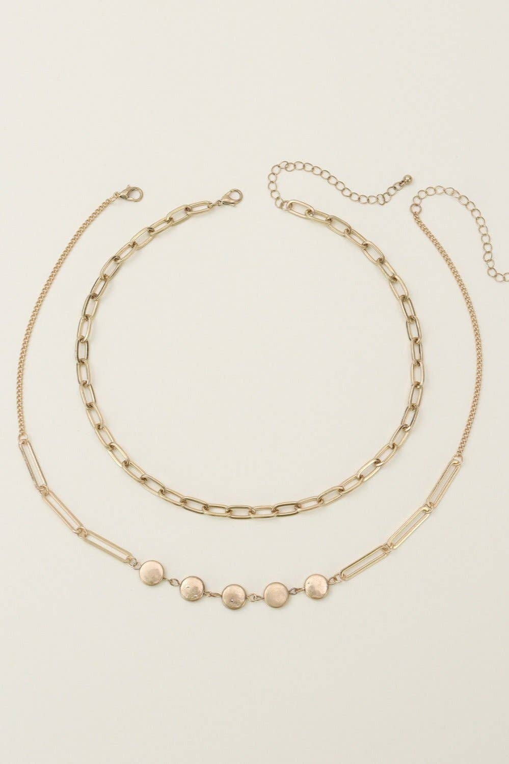 Two layer chain necklace set featuring a delicate gold chain and a beaded accent, ideal for layering or standalone wear.