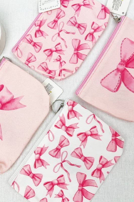 BOW ME OVER COSMETICS BAG collection featuring pink bow designs, perfect for organizing makeup essentials.