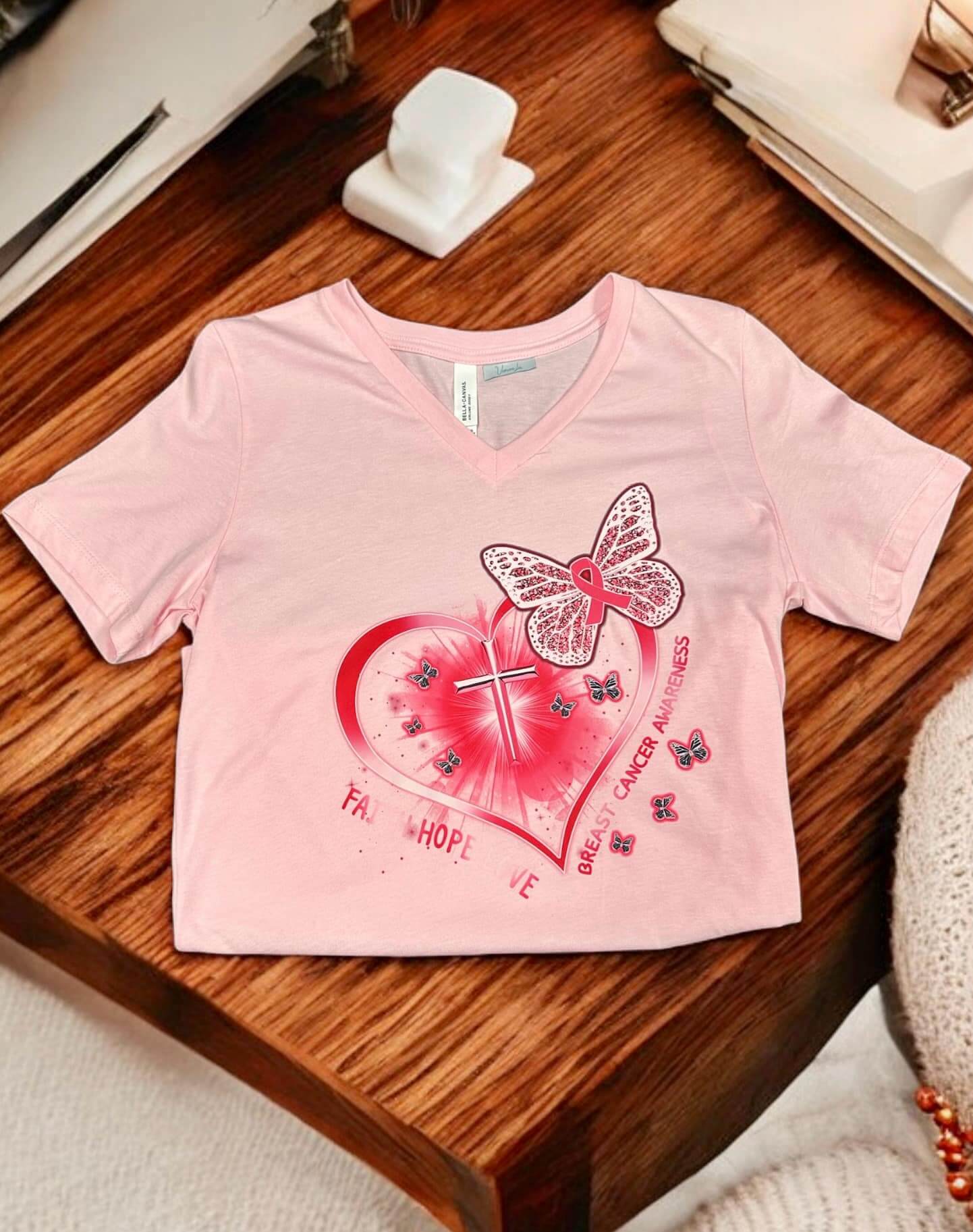 FAITH HOPE LOVE T-Shirt in pink, promoting Breast Cancer Awareness with heart and butterfly design.