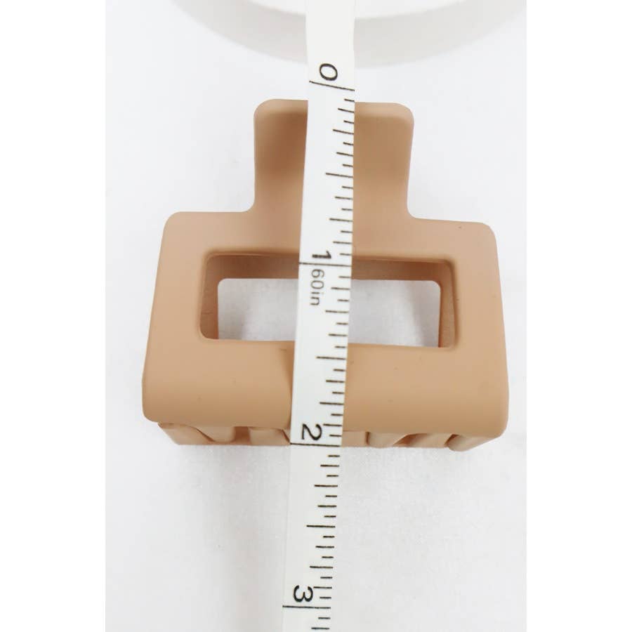 Matte About You hair clip set on white background with measuring tape for size reference