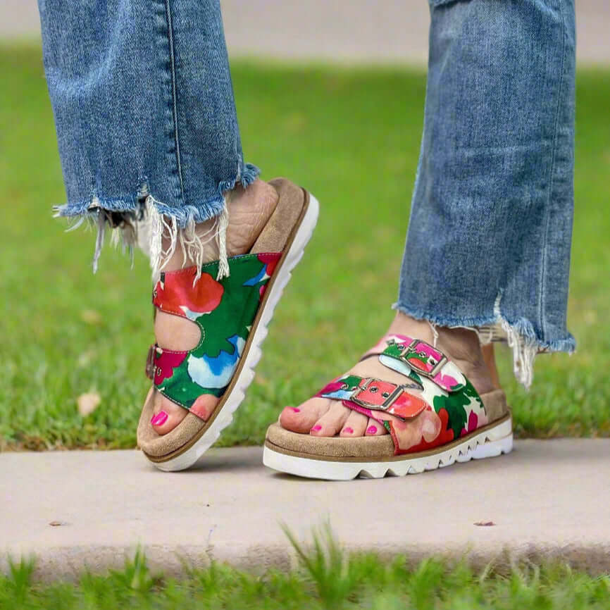 Corkys Dash Floral Sandals on a woman, vibrant design perfect for summer outings and stylish comfort.