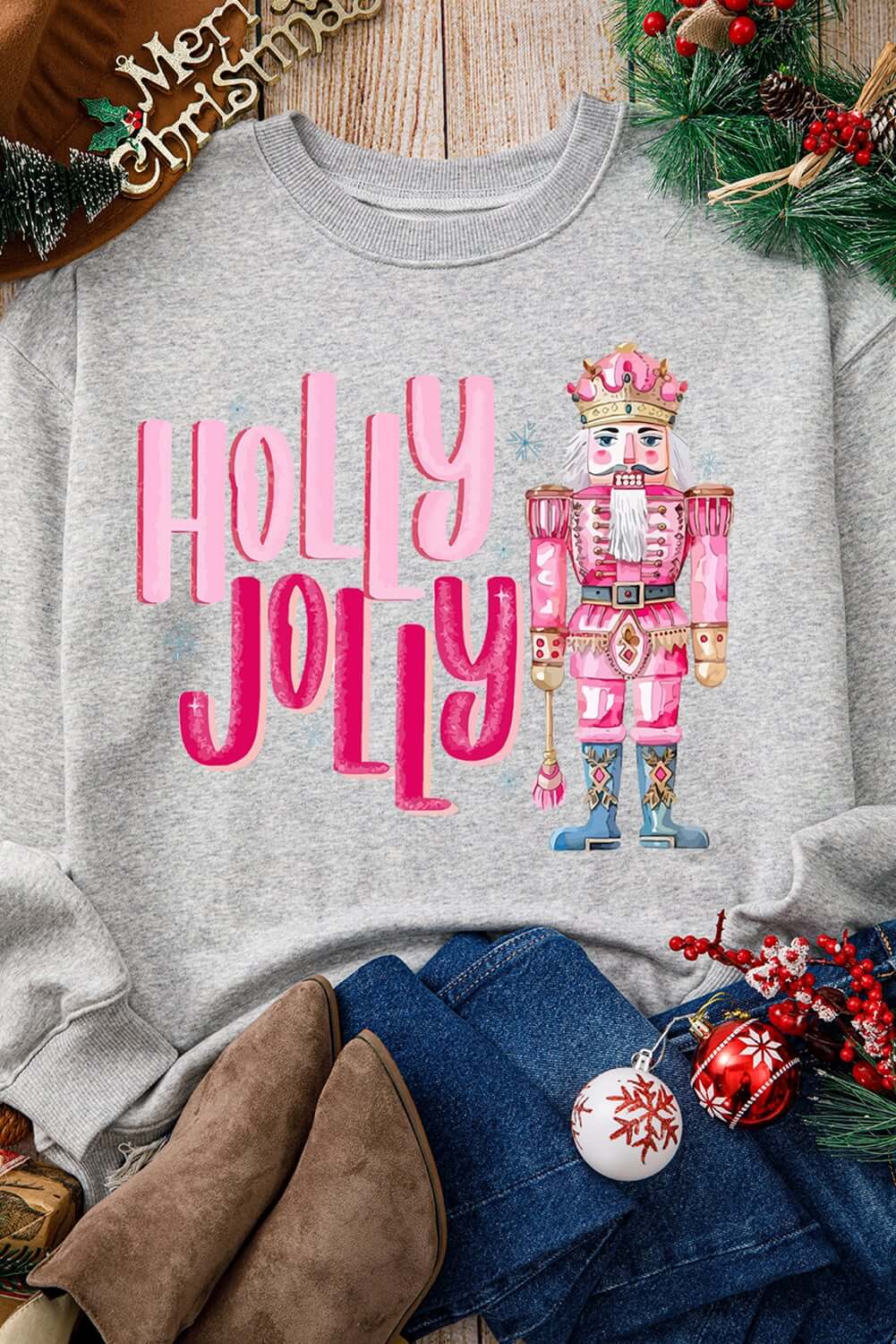Holly Jolly Nutcracker sweatshirt with pink prints, perfect for festive holiday outfits.