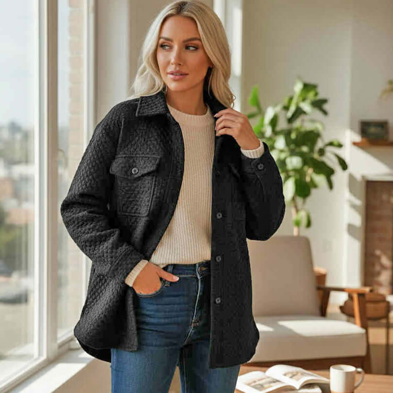 WARM IMPRESSIONS BUTTON DOWN black quilted shacket worn by woman indoors with natural light.