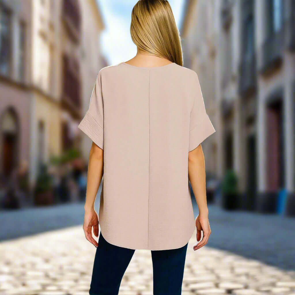 Back view of woman wearing Zenana Soft Breeze Top in light mocha, showcasing its relaxed fit and stylish design.