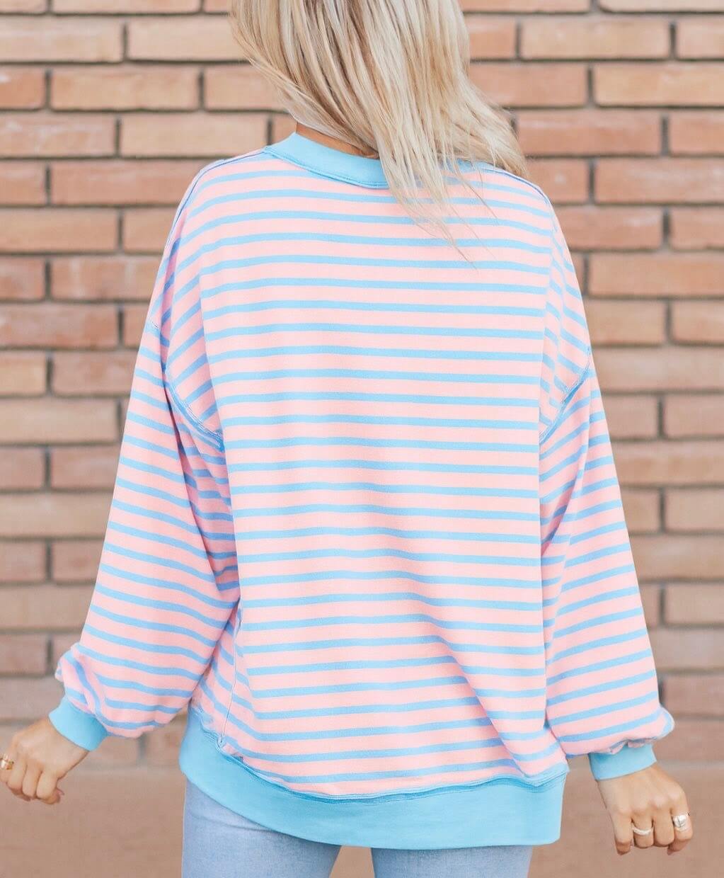 Back view of the SALTWATER TAFFY TOP featuring soft pink and aqua stripes, perfect for a stylish casual look.