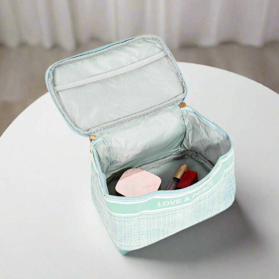 Open LOVE & PEACE cosmetic bag showcasing interior storage for beauty products.