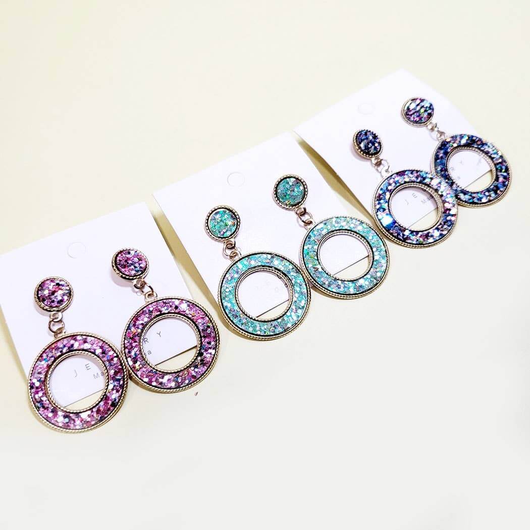 Confetti Dazzle Earrings in Pink, Mint, and Violet showcasing vibrant colors and glittering design.