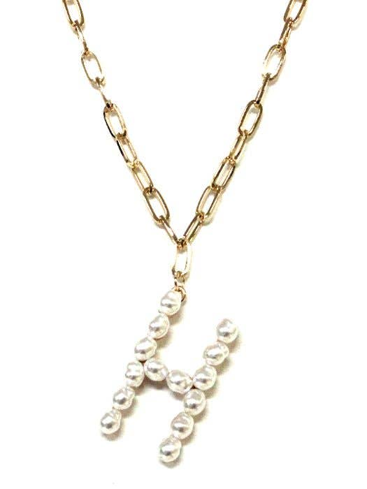 PEARL ESSENCE MONOGRAM NECKLACE by Avenue Zoe with freshwater pearls on a gold-tone chain.